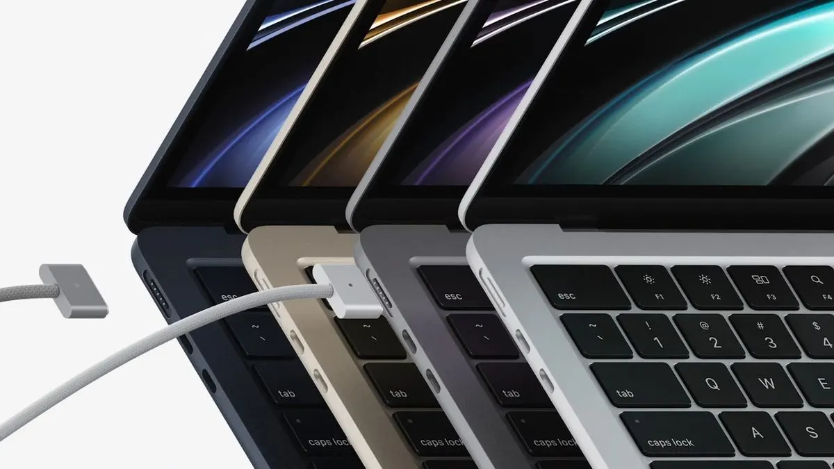 Side profile of the M5 MacBook Air showing its thin design and MagSafe charging cable.